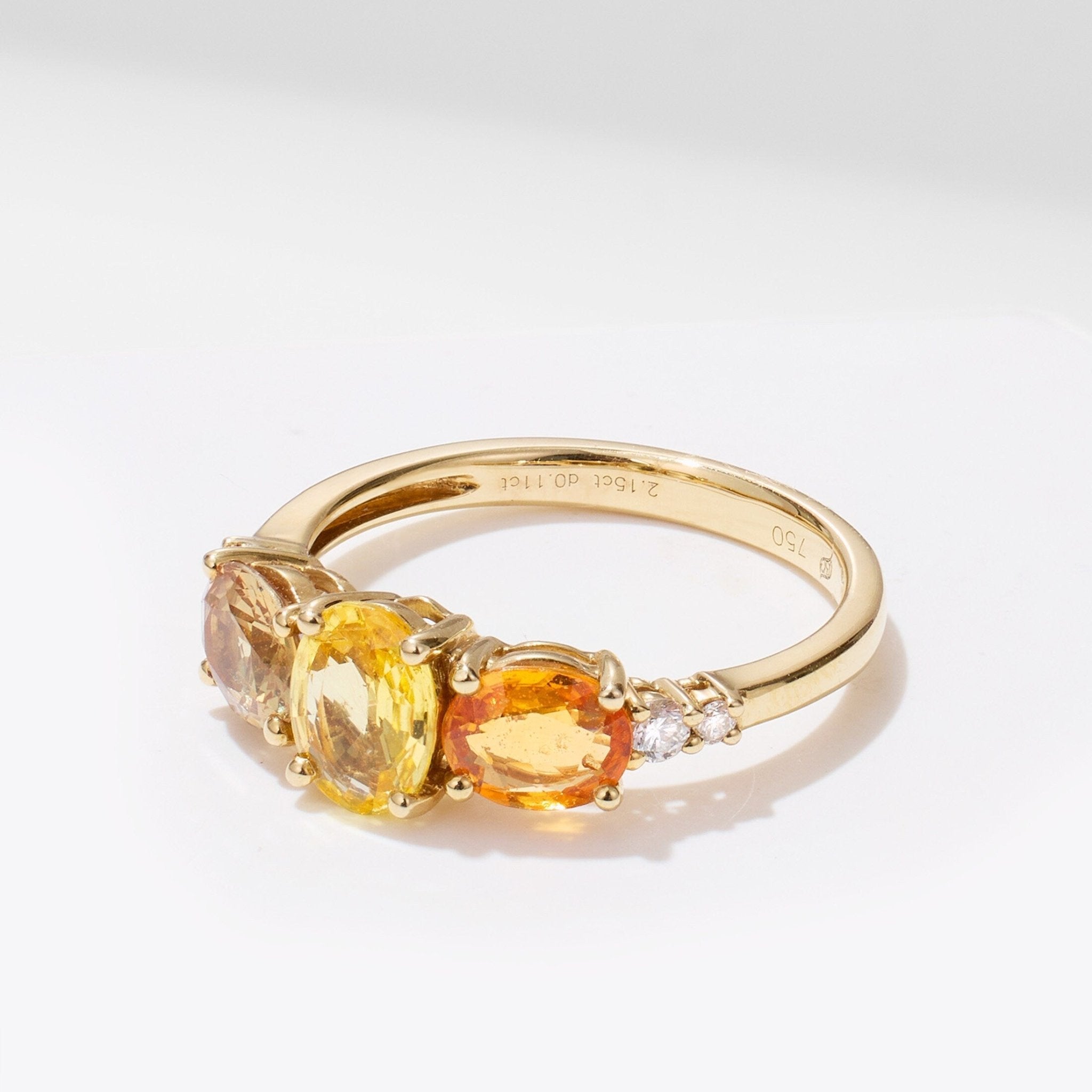 Oval gem and diamond ring